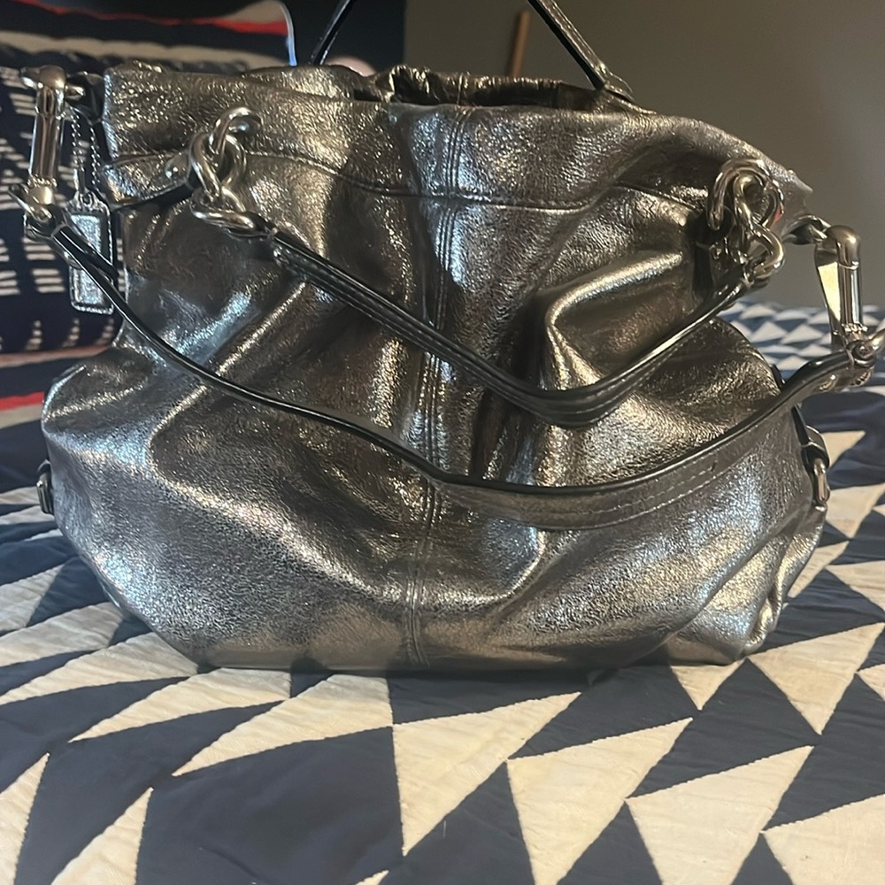 Rare find. Metallica Silver Coach purse.